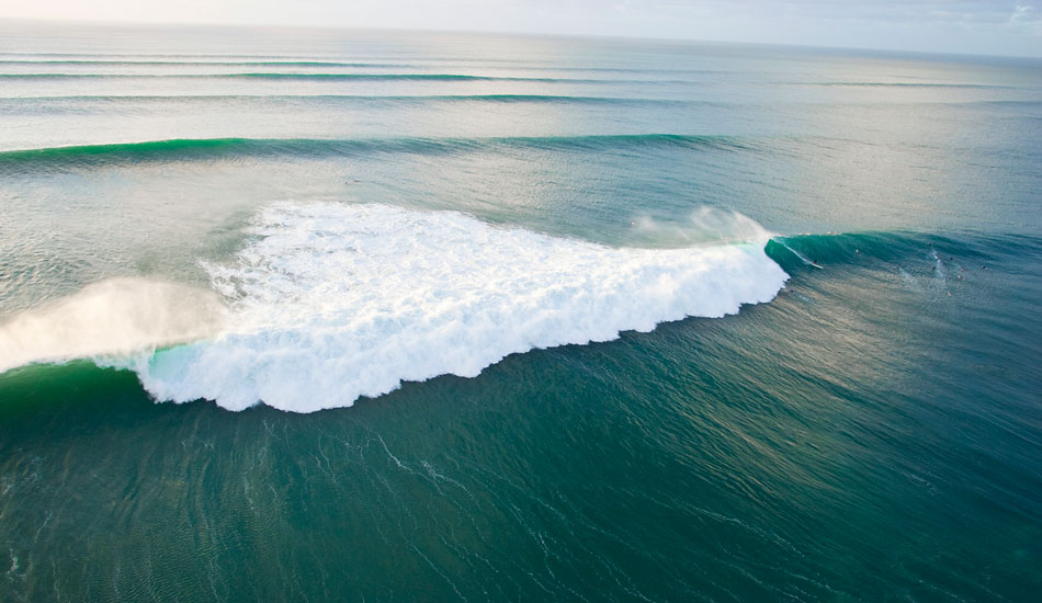 A helicopter overview of a 15-foot wave at Pipeline, on the north shore of Oahu, Hawaii. Photo: Sean Davey