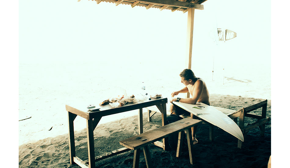 I love this shot of Andy at Keramas before the new Kommine resort was built. He is simply getting his gear ready for a surf, but it says a lot about where he was at the time as a person. Confident, content, happy and secure in his own space. Photo: <a href=\"https://www.reposarphoto.com\">Jason Reposar</a>
