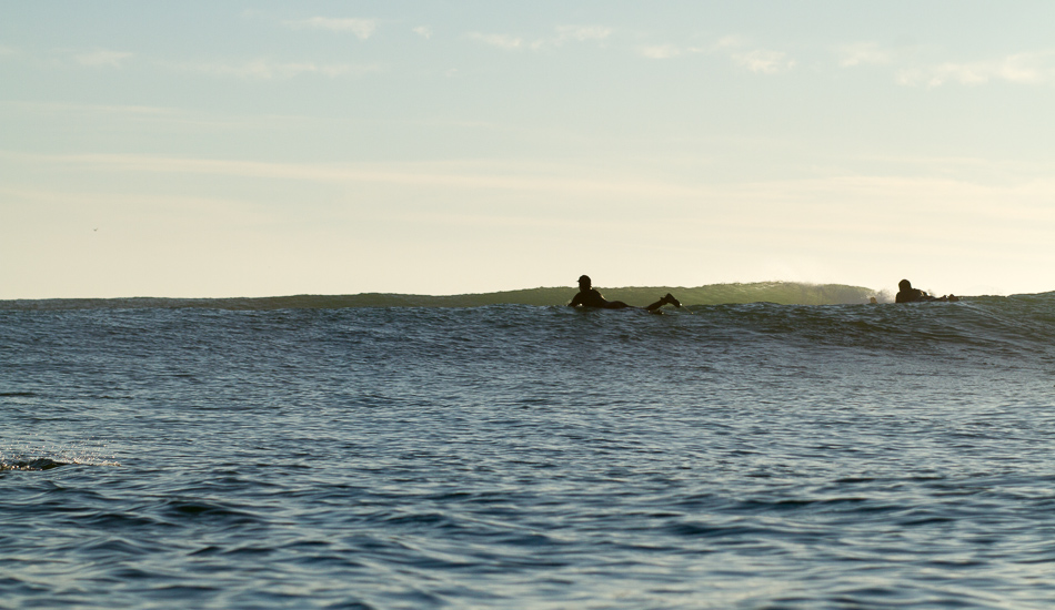 Paddling back out and the swell keeps pumping.  Photo: <a href=\"https://lowtiderising.com\">Aroyan/lowtiderising.com</a>