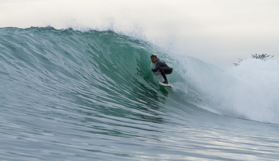 Dane Reynolds perfecting the double arm drag to stay high and low. Photo: <a href=\"https://lowtiderising.com\">Aroyan/lowtiderising.com</a>