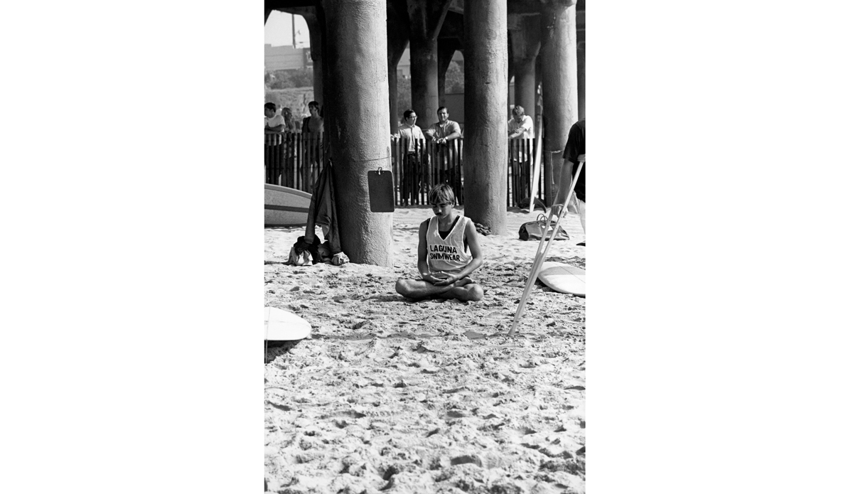 Gerry Lopez yoga meditation before his heat at the 1969 Huntington Beach contest. Image: <a href=\"https://www.artbrewer.com/\" target=\"_blank\">Brewer</a>