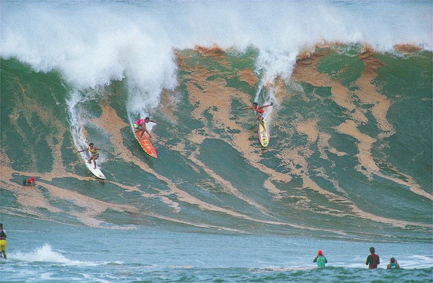 1988. Dennis Pang, Marvin Foster and Mark Foo at Waimea Bay. Photo: <a href=\"https://www.artbrewer.com\" target=_blank>Art Brewer</a>
