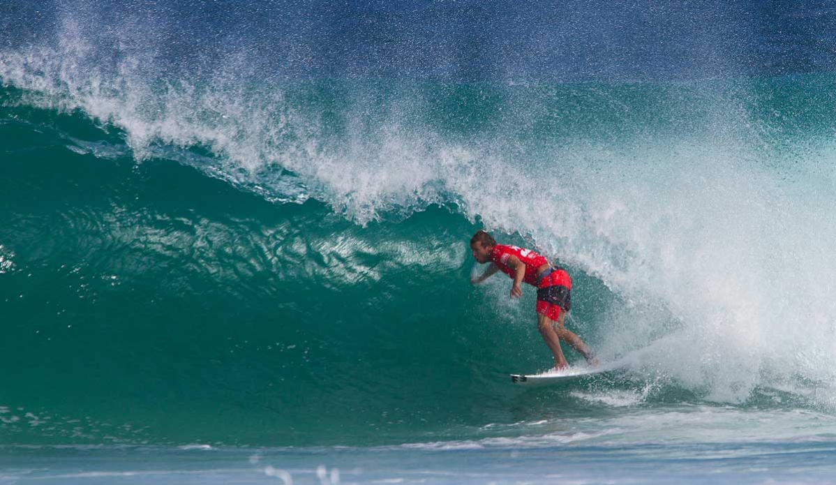 Taj Burrow of Yallinup, Western Australia, battled both his opponents to win his Round 4 heat advancing into the Quarterfinals. As conditions deteriorated in the final heat of the day, Burrow narrowly edged out opponents Josh Kerr (AUS) and Michel Bourez (PYF) in a low-scoring affair. Photo: <a href=\"https://www.aspworldtour.com/\">ASP | Smorigo</a>