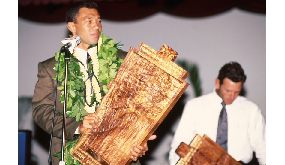 A young Sunny Garcia gives his acceptance speech after raising the Triple Crown trophy. This was one of his six Triple Crown titles – the most ever (\'92-\'94, \'99, \'00, \'04). Photo <a href=\"https://www.aspworldtour.com\">courtesy of the ASP</a>