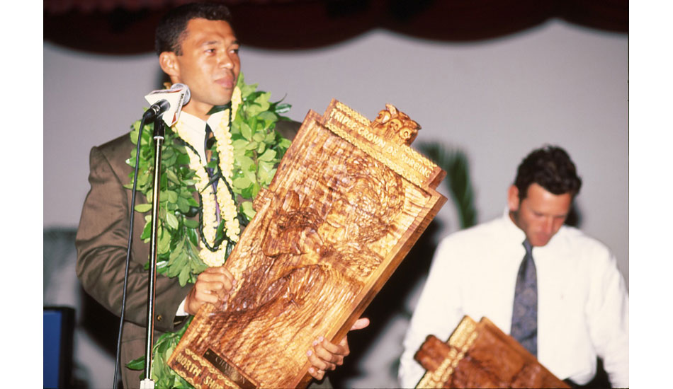 A young Sunny Garcia gives his acceptance speech after raising the Triple Crown trophy. This was one of his six Triple Crown titles – the most ever (\'92-\'94, \'99, \'00, \'04). Photo <a href=\"http://www.aspworldtour.com\">courtesy of the ASP</a>