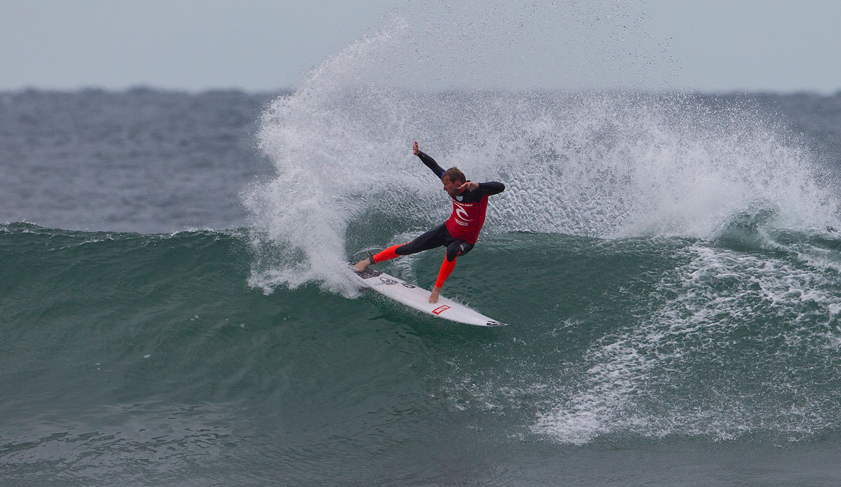 Taj Burrow of Yallinup, Western Australia (pictured) won his Round 1 heat at the Rip Curl Pro Bells Beach defeating Nat Young and Tiago Pires on Saturday April 19, 2014. Burrow was in sensational form posting the highest heat score of the Round a 15. 77 (out of a possible 20.00 points) to advance directly into Round 3. Photo: <a href=\"https://www.aspworldtour.com/\">Kirstin/ASP</a>