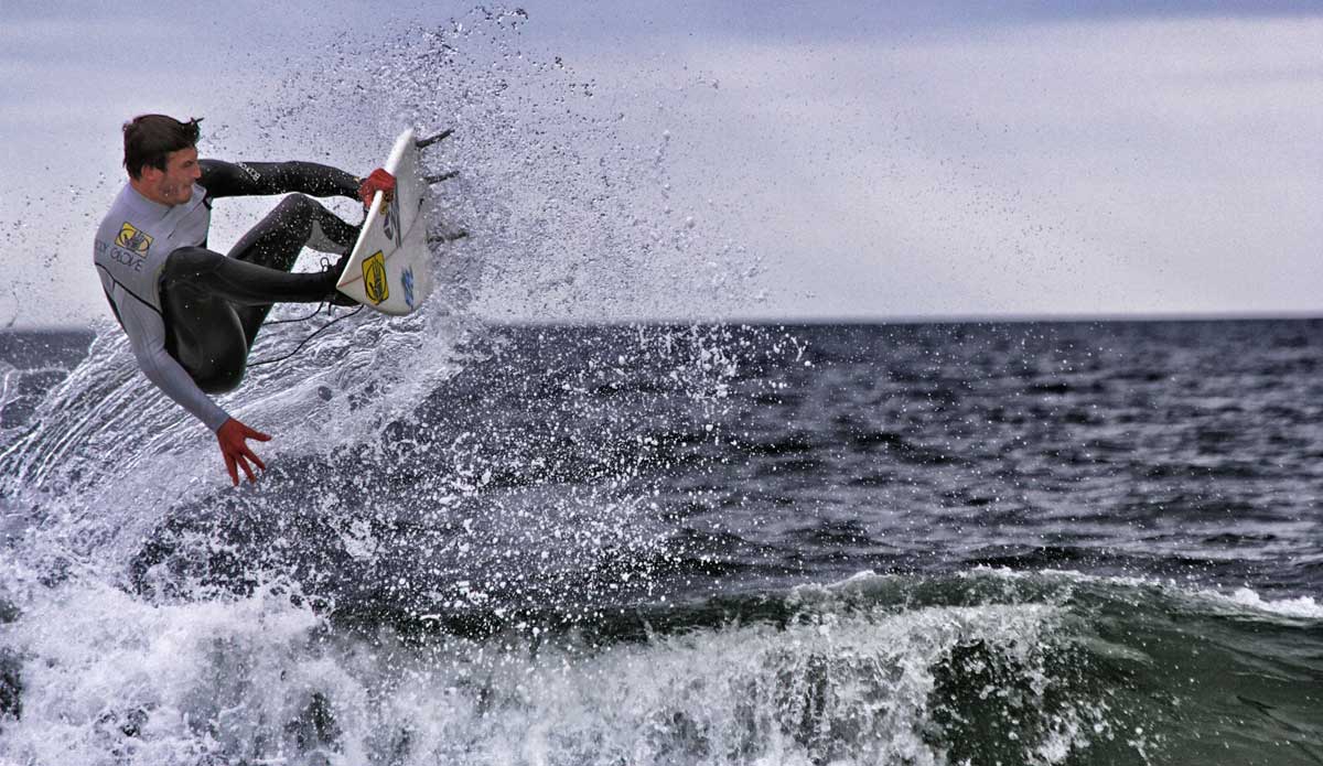 Here\'s Clay Pollioni doing what he loves, and me doing what I love. I used to be the guy standing in barrels, but I\'d rather get the shots first then go surfing. Sometimes I have to miss the best days. All worth it to me. I\'m truly dedicated to surf photography and hope that I continue to only get better. This shot was with my 6-month-old strapped to me in a harness thing and, at that time, nothing could stop me from shooting every bump that came in. Photo: <a href=\"https://bencurriephoto.zenfolio.com/\">Ben Currie</a> 
