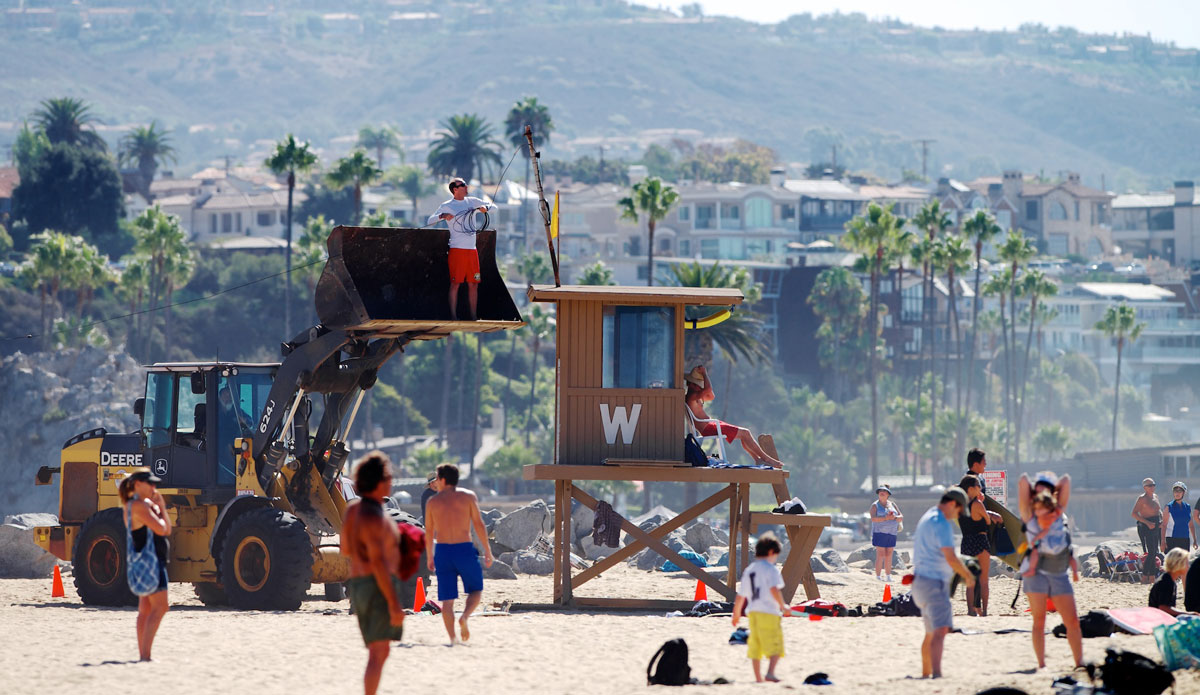 Big waves pulled so much sand off the beach at The Wedge that lifeguards and Public Works had to drag Tower W back from the 10-foot sand precipice. Photo: <a href=\"https://www.driftwoodfoto.com/\">Benjamin Ginsberg</a>