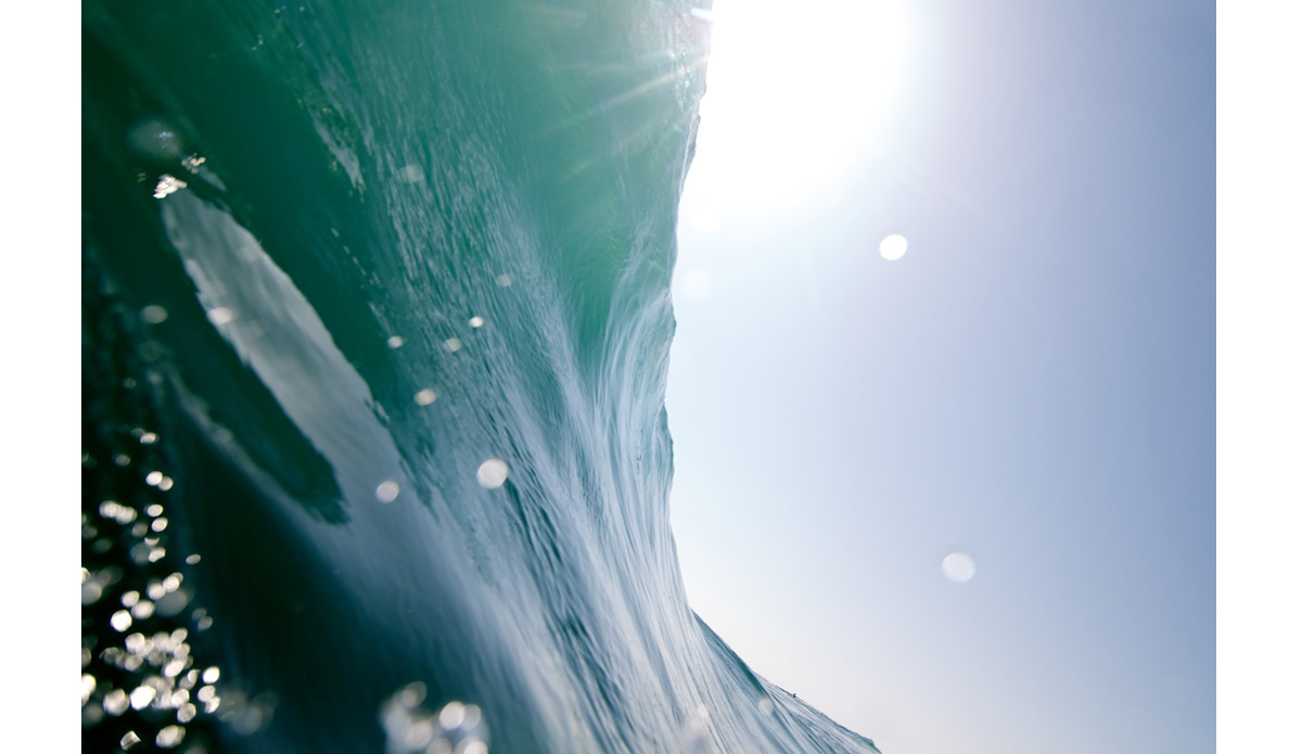 The bigger the wave here, the harder it is to get that classic, over-head barreling watershot; you\'re more focused on survival. Note that little black dot towards the bottom right of the wave: that\'s a bodyboarder. Photo: <a href=\"https://www.driftwoodfoto.com/\">Benjamin Ginsberg</a>