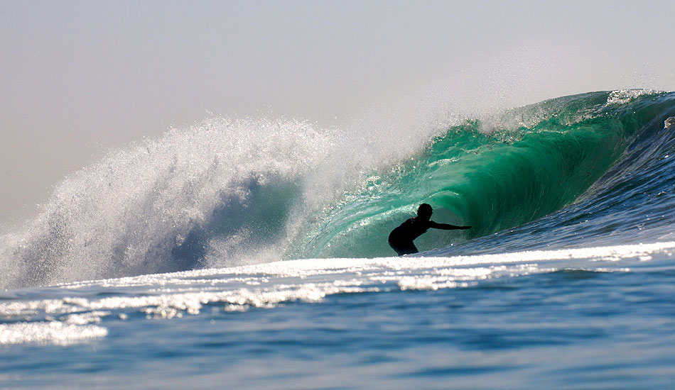 I love using a long telephoto lens when I shoot from the water. Local surfer finds some shade in a drainer in Newport Beach, CA. Photo: <a href=\"http://driftwoodfoto.com/\">Ben Ginsberg</a>