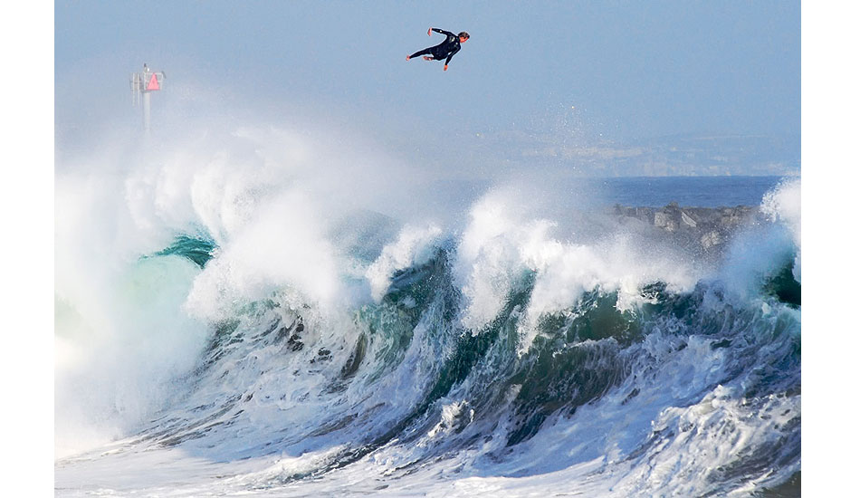 Bobby Okvist airing it out over a triple-overhead wave at Newport Beach\'s The Wedge. I\'m incredibly honored that this image placed Top 50 Overall, and Top 5 in the Wings category, for the 2013 Red Bull Illume contest. Photo: <a href=\"http://driftwoodfoto.com/\">Ben Ginsberg</a>