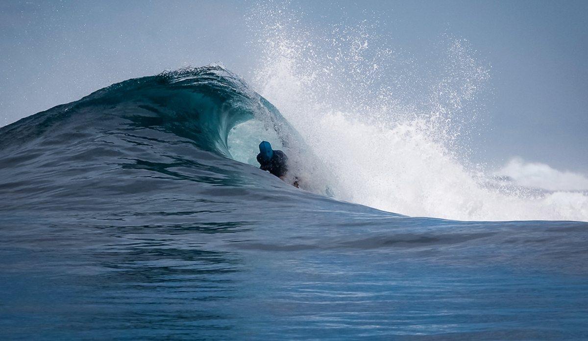 Being a surf guide, you get a lot of sun exposure, but there are a few unorthodox ways to keep the sun at bay.  Here, Clark Plaiser uses 2 proven methods of a mask and some barrel time.  Upola, Samoa.