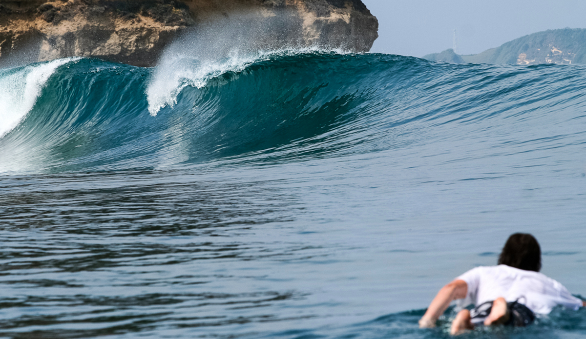 Paddling into an empty line-up on a remote section of South Lombok.  Lombok, Indonesia.
