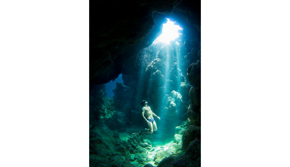 Yoram Zekri, professional freediver, exploring a cave in Tahiti. Photo: <a href=\"https://benthouard.com/\" target=_blank>Ben Thouard</a>.