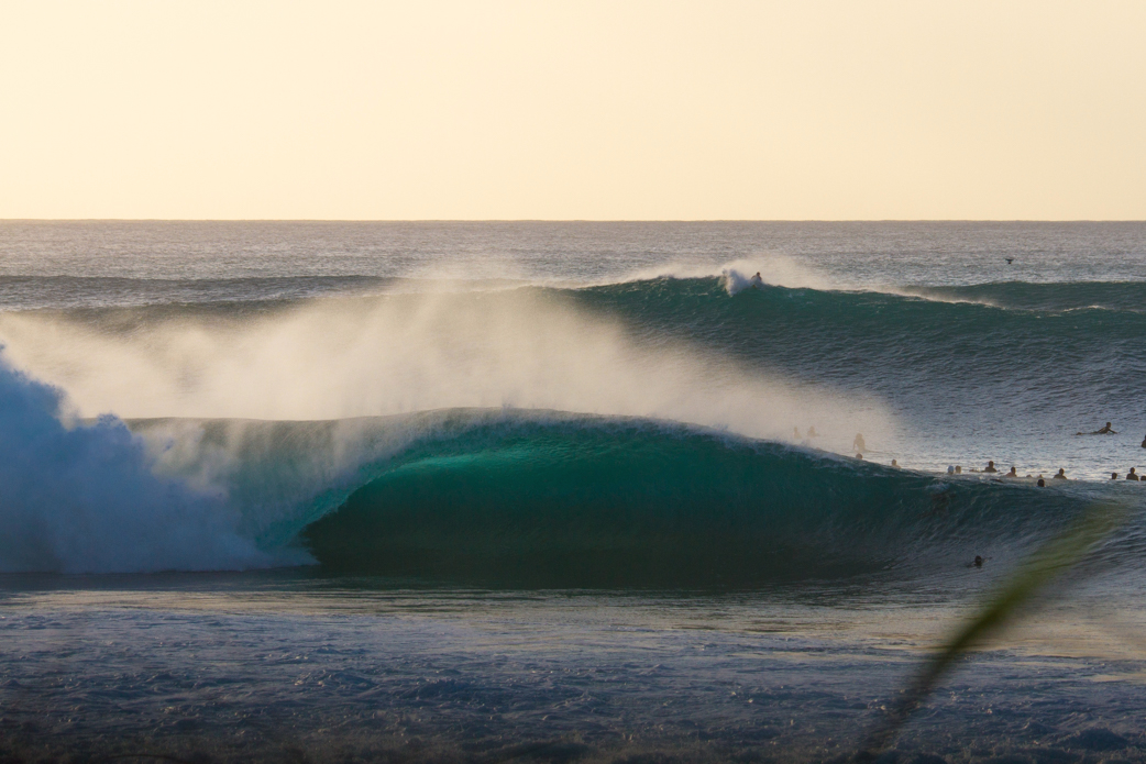 Mid-December Pipeline was perfect and a rare empty going through the crowded lineup. Photo: <a href=\"https://www.shigephoto.co/\">Gavin Shige</a>