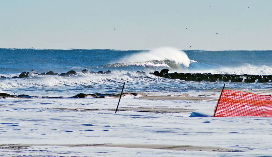 Snow-covered beaches halt crews from dredging, giving this sandbar a little extra longevity. Photo: Tim Leopold from <a href=\"https://www.theinertia.com/surf/snow-folio-tim-leopold/\" target=\"_blank\">Snow-folio: Tim Leopold</a>