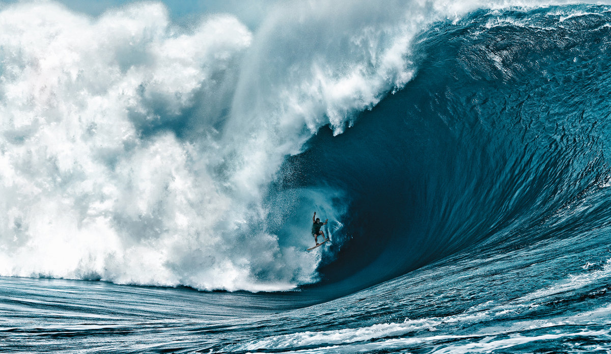 Nathan Fletcher at Teahupoo in Tahiti on the code red swell. This is the craziest wave ever ridden by a human. Yes he survived. Photo: <a href=\"https://www.brianbielmann.com\">Brian Bielmann</a>