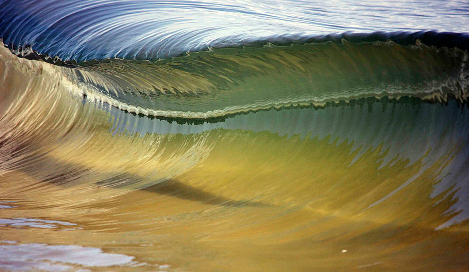 Hard to believe this wave is just 15cm in height. The wind was howling offshore producing the ripple effect captured in the inside of the wave. With the reflection of the sun and sand, the colors were magnified. Photo: <a href="https://www.debmwaveart.webs.com/" target=_blank>Deb Morris</a>.