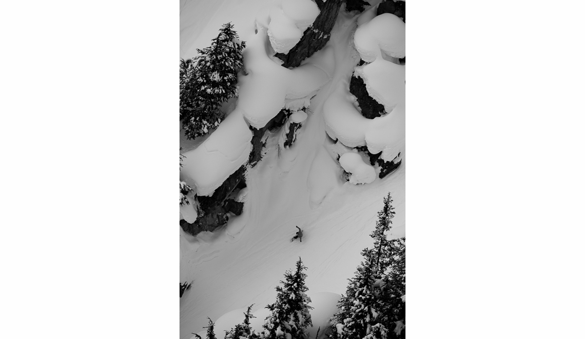 Swiss snowboarder Frederik Kalbermatten closes out a long powder run through an oversized gully at the bottom of the mountain…everything is bigger in Alaska. Photo: <a href=\"https://deanblottogray.com/\">Blotto</a>