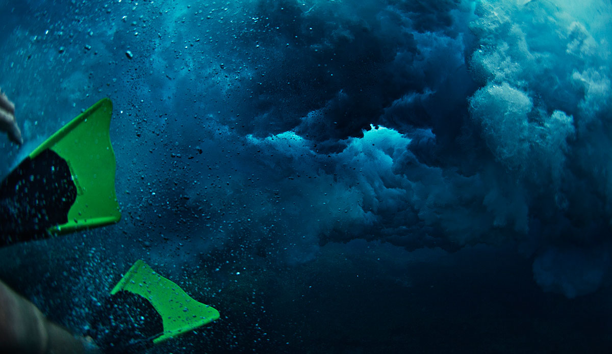 Slipping through the Threshold.  There\'s nothing cooler than having a large wave flush right over your body and escaping the wrath that waves are known to deliver.  Photo: <a href=\"https://www.bobridges.com/\">Bo Bridges</a>