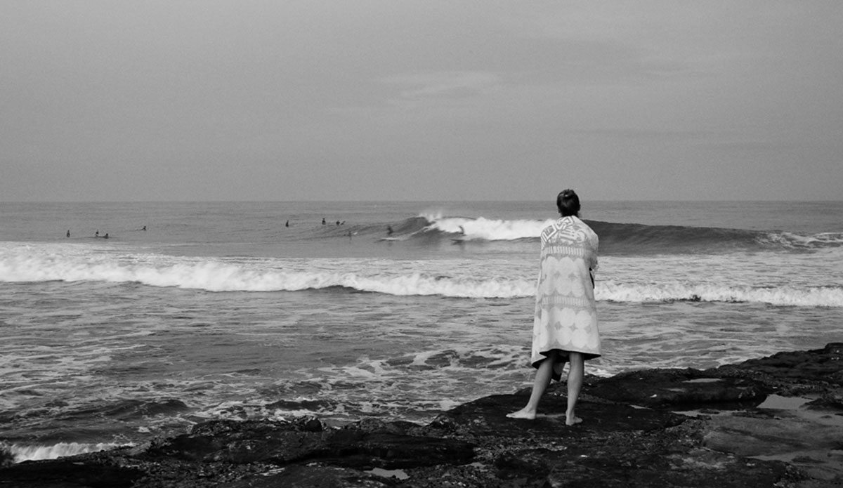 The surfer\'s girlfriend. Her body language says it all and she\'s not happy. At this point, I started to include people into the photos to help tell a story greater than what was really happening in the photograph. Asbury Park, New Jersey. Photo: <a href=\"http://jerseyshoreimages.com/about.html\">Robert Siliato</a>