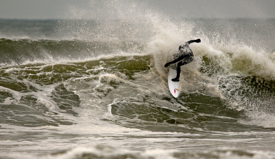 Unknown surfer throwing some frothy spray. Photo: <a href=\"http://jerseyshoreimages.com/about.html\">Robert Siliato</a>