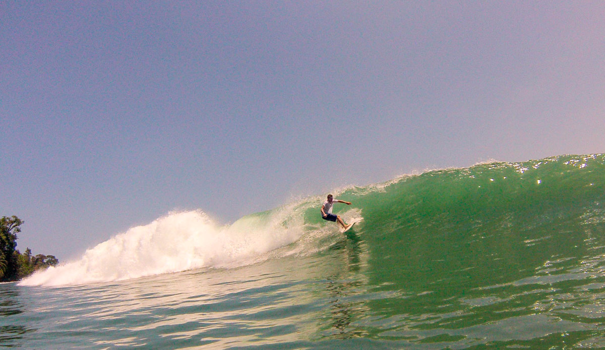Kai Rogers (@kai_rogers) after popping out of a fast tube at Dumps. Kai has spent many summers in Bocas Del Toro and had a house in the village. Kai and was our local connection, and the trip would not have been possible without him. Photo: <a href=\"https://www.facebook.com/ColinRothPhoto\"> Colin Roth</a>