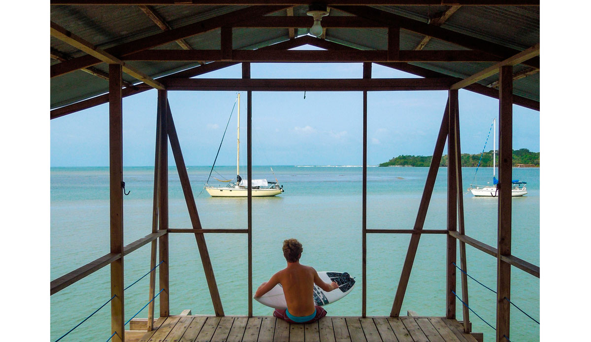 It\'s a great feeling scraping off your Central California cold water wax and laying down a fresh layer of tropical wax. Tyler Correll (@tylerwcorrell) probably smiling from ear to ear as he applies on the dock\'s second story. Photo: <a href=\"https://www.facebook.com/ColinRothPhoto\"> Colin Roth</a>