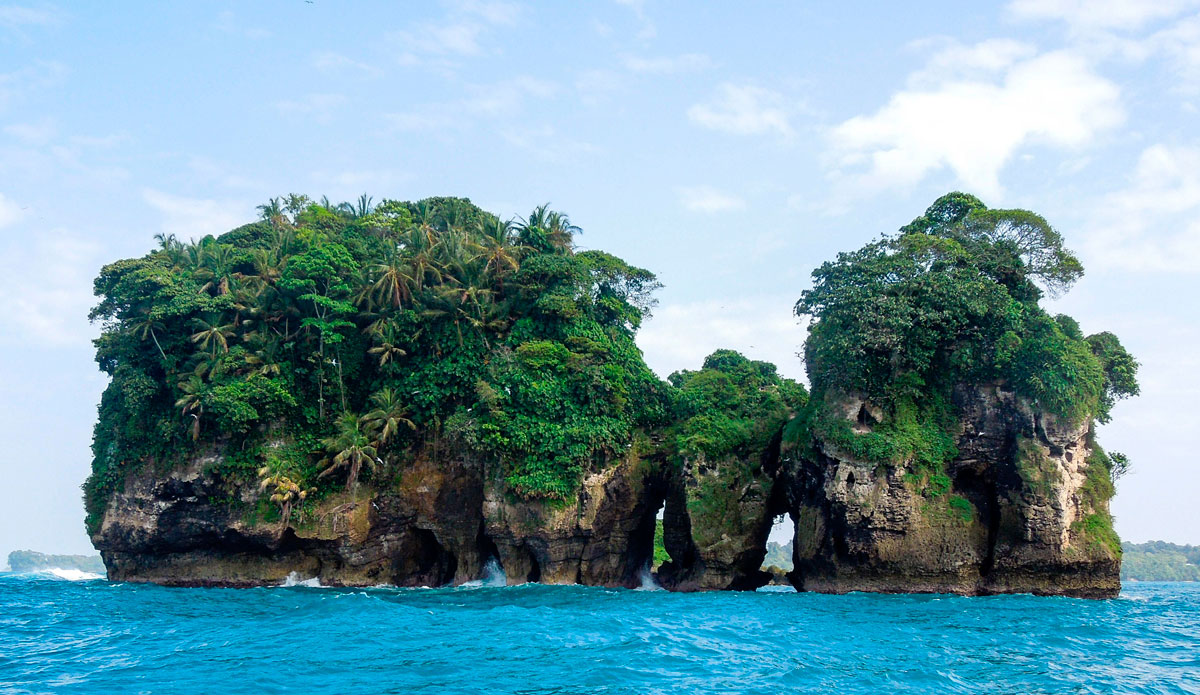 Kai, our local connection, took us out to a crazy island way offshore. It looked like something out of Jurassic Park. It was appropriately named Bird Island, as there were tons of interesting birds flying everwhere. Legend has it a huge Barracuda lives in the water under the natural arches. Photo: <a href=\"https://www.facebook.com/ColinRothPhoto\"> Colin Roth</a>