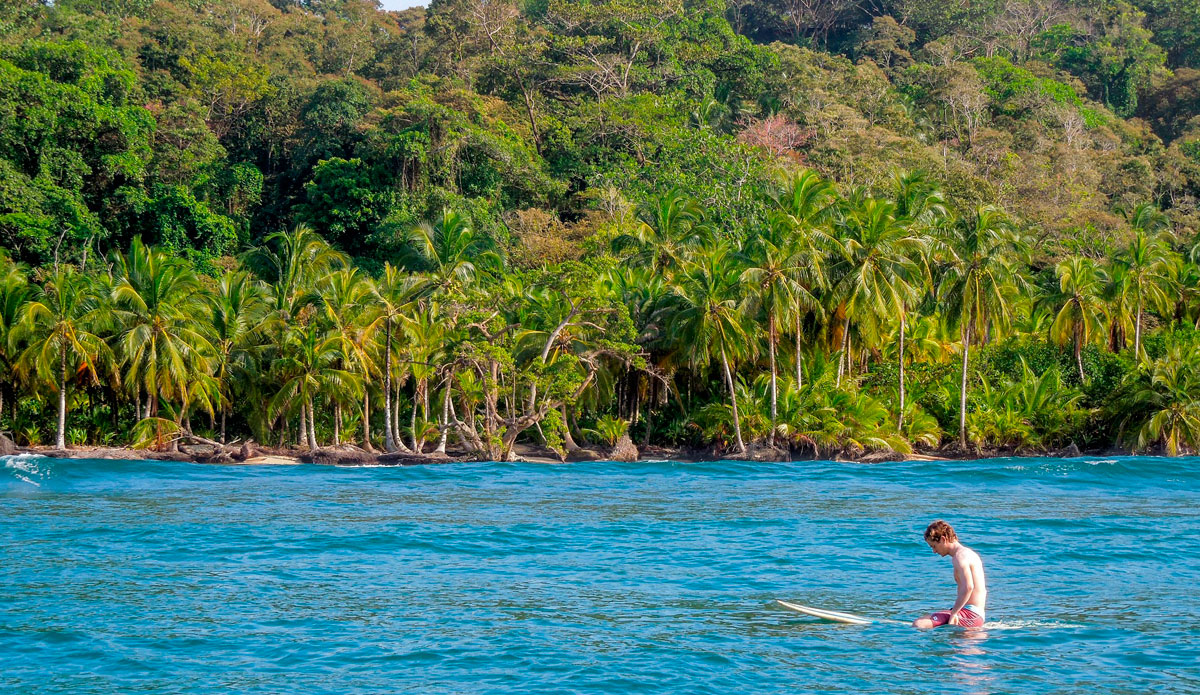 One afternon we decided to take out the longboards and see if we could bring a bunch of beer to shore and hang out on a secluded beach. It resulted in bloody scrapes, Urchin nettles in feet, and a lot of popped beers over the reef. We decided just to surf instead. Photo: <a href=\"https://www.facebook.com/ColinRothPhoto\"> Colin Roth</a>