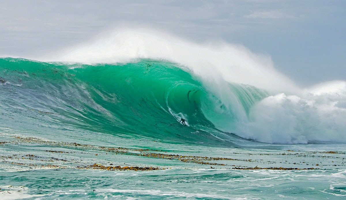 Carlos Burle, Pescadero Point, December of 2007. Day 1 of the same swell featured in the Scratchin\' image. After wrestling with gigantic Ghost Trees, we drove fourteen hours down to Ensenada to chase the swell to Todos. Photo: <a href=\"https://www.photomurray.com/\">Jason Murray</a>