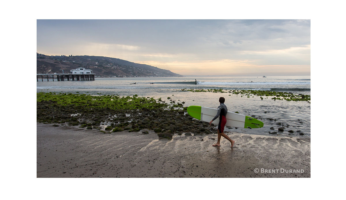 Real surfers can’t stop watching the waves, even when they’re leaving the beach. Photo: <a href=\"https://instagram.com/brentdurand\">Brent Durand</a>