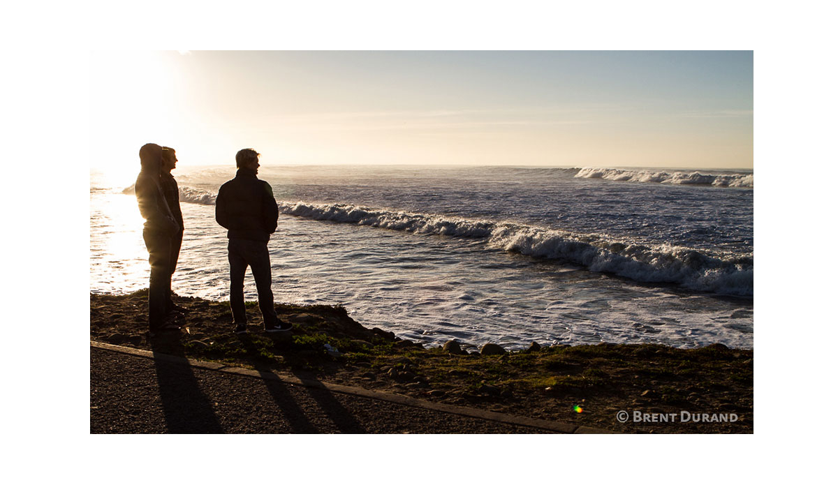 Surfers spend some time watching big surf at C-Street before paddling out. Photo: <a href=\"https://instagram.com/brentdurand\">Brent Durand</a>