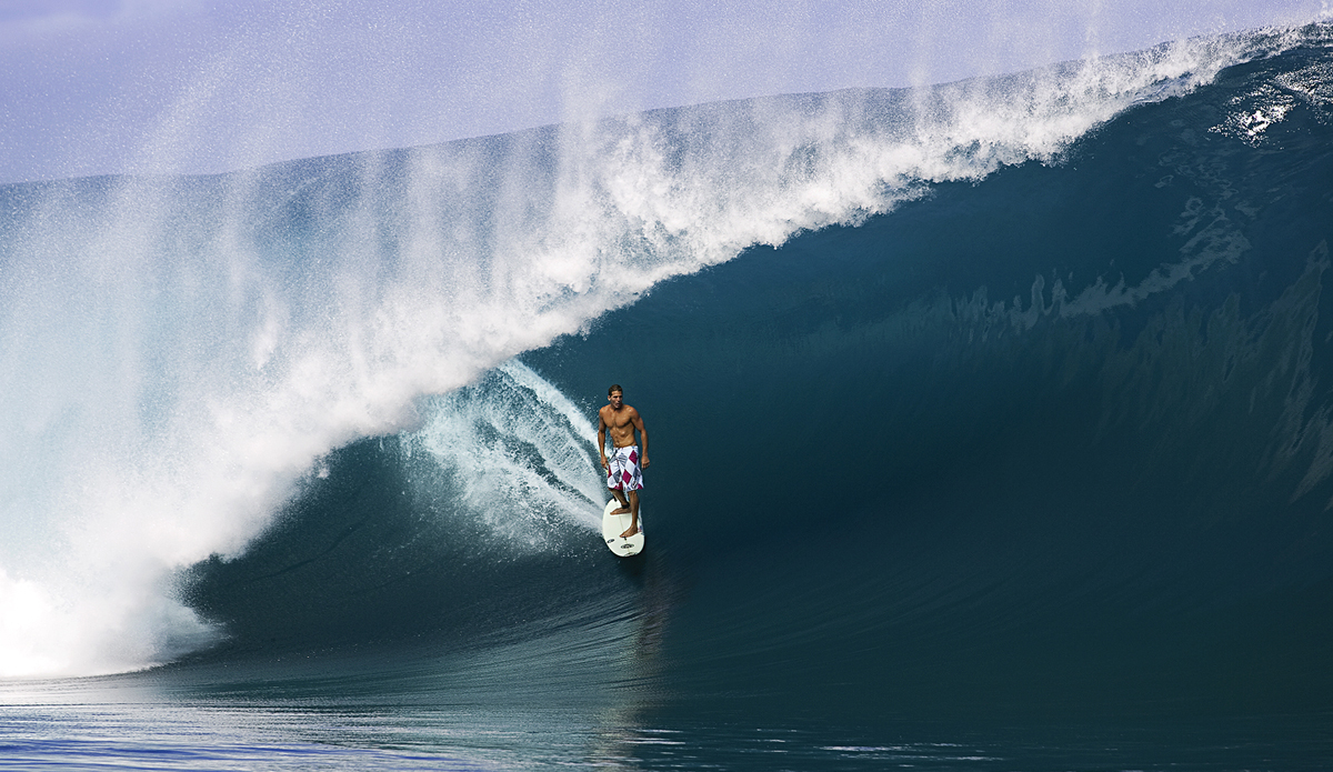 The late great Andy Irons standing tall in a tube at Teahupoo in Tahiti. Like a King.