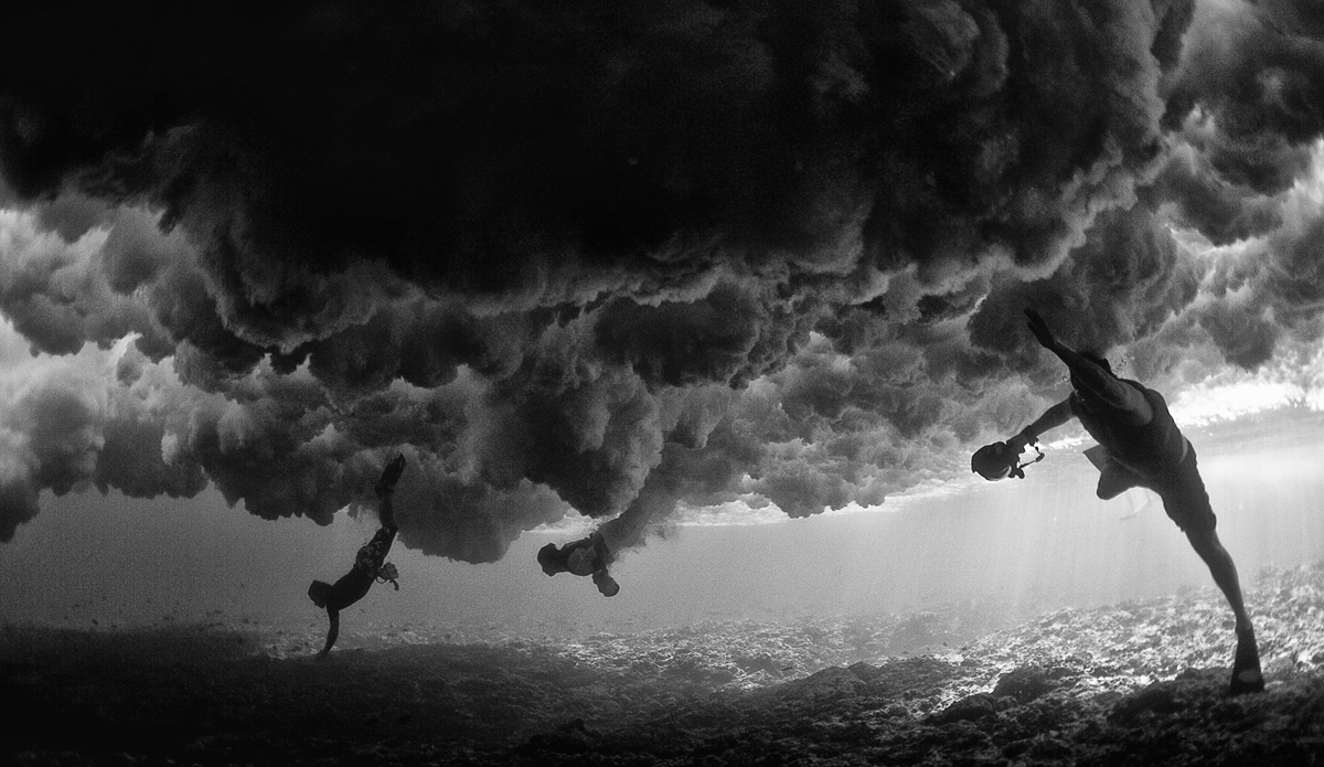 This was my first water session in Tahiti. As this wave came through much bigger than I expected, I turned the camera towards the other photographers swimming beside me just before the wave hit.