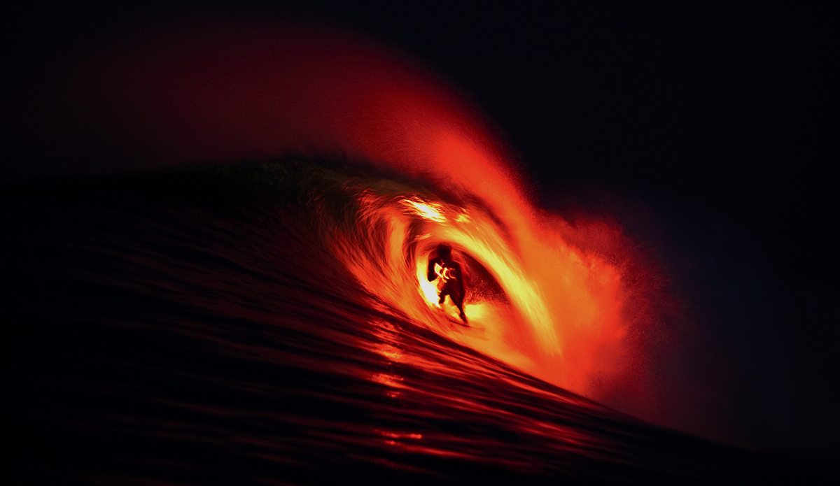 Bruce Irons in Indonesia. We strapped a flare to the back of his surfboard and shot this before the sun came up at 5 a.m.