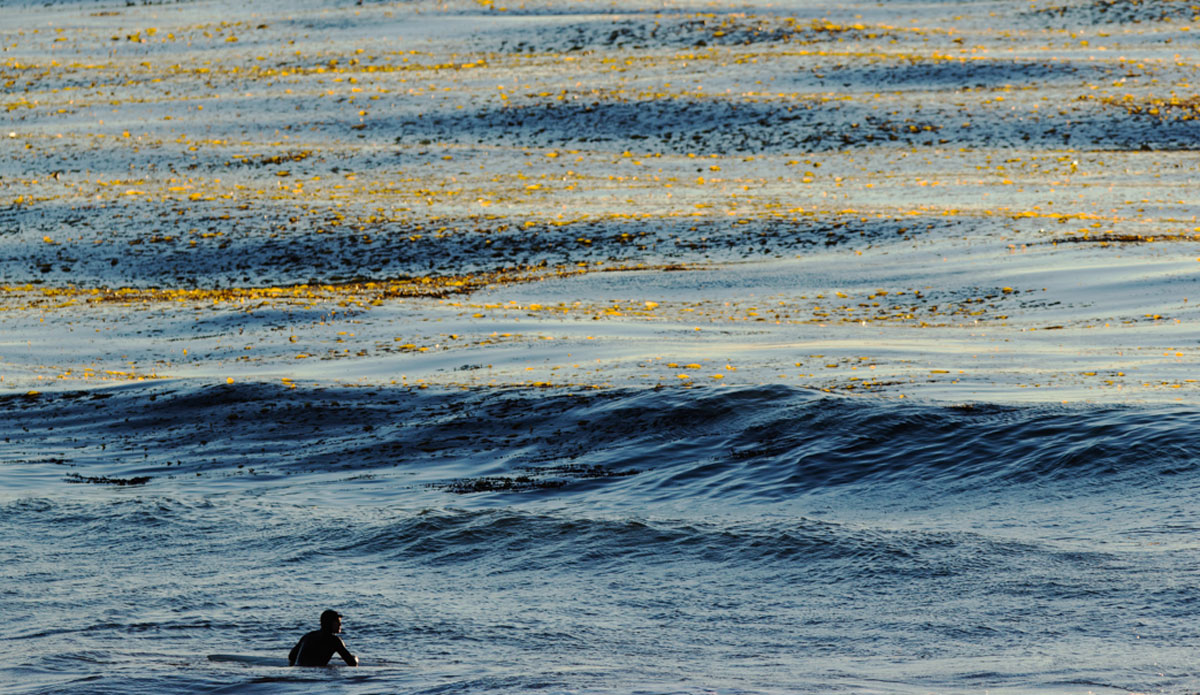Solitude.  I love being able to capture surfers sitting and admiring the ocean.  It\'s the whole reason we go out there. To get away from today\'s world and enjoy nature. Photo: <a href=\"https://www.kincaidcliffordphotography.com/\"> Brian Clifford</a>