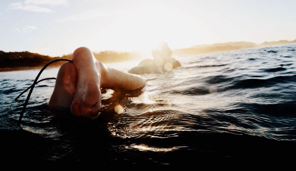 Clutched clinging heels. Playa Guiones, Costa Rica. Photo: <a href=\"https://cargocollective.com/brigidlallyphotography\">Brigid Lally</a>