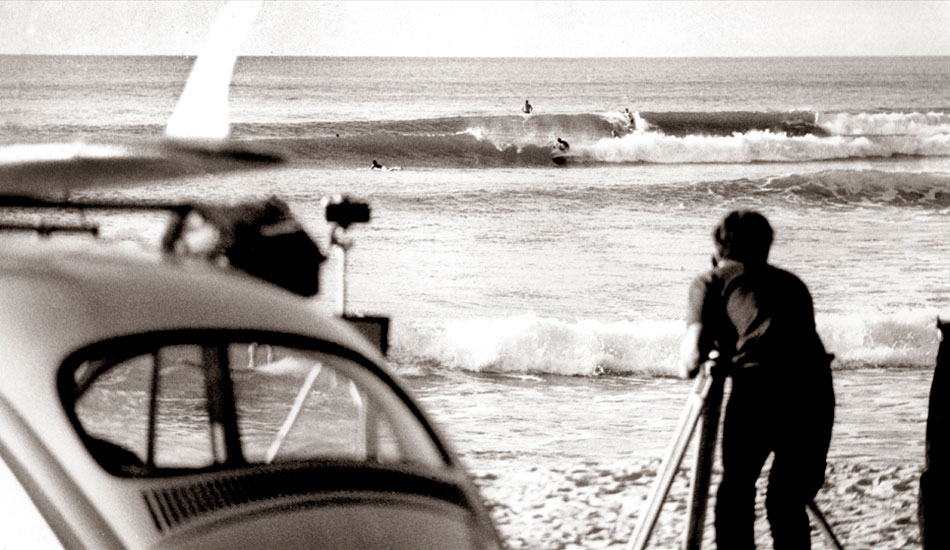 Noosa Heads,  First Point 1967 - 
Taken from the car park at first point on a trip to Noosa Heads in late autumn or early winter.
My white 1960 VW, standard is on the LHS of the image and framed in the back window are the legs and   board of a surfer on the shore break.   Andy McAlpine is behind the timber tripod filming Children of the Sun. Photo: <a href=\" www.bruceusher.com.au\">Bruce Usher</a>    