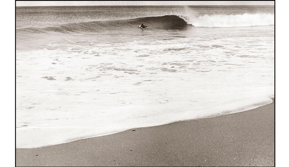 Mona Vale Wave  1977 - I photographed this playful offshore wave early one morning in autumn 1977.
I used a 50mm lens, a lens that I found very boring(I was pushing my boundaries), because I
normally have a preference for long telephoto or wide angle lens.
I don’t know if the surfer in the black wetsuit dates the image or it appears as a timeless classic wave. Photo: <a href=\" www.bruceusher.com.au\">Bruce Usher</a>
