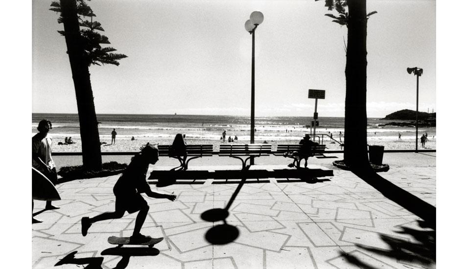 Manly Skater, 1994 - I had a client who wanted me to photograph a range of Sydney postcards and that included trying to get an iconic image from Manly, which was not as easy as it sounds. I stood in the this spot for thirty minutes waiting to see who or what might interact with the shadows from the lamp and the Norfolk Island Pine. The patience paid off but the postcard range didn’t. Photo: <a href=\" www.bruceusher.com.au\">Bruce Usher</a>