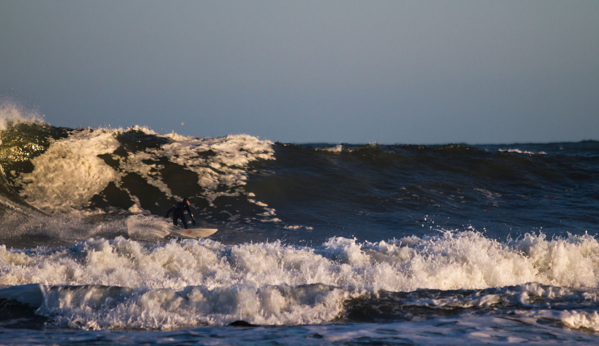 Joel Feid in some solid storm surf. Photo: <a href=\"https://www.bryannicholson.com/\">Bryan Nicholson</a>
