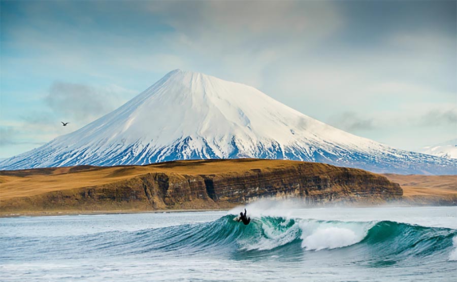 This shot from the Aleutian Islands was made famous as part of Burkard\'s Cradle of Storms project with Surfer magazine.