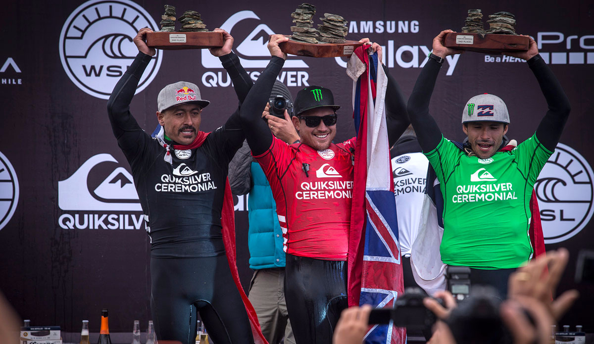Quiksilver Ceremonial finalists third place finalist Ramon Navarro of Chile (left), Champion Makua Rothman of Hawaii (centre) and Runner Up Christian Merello of Chile celebrate on the podium at Quiksilver Ceremonial on Friday May 1, 2015. Photo: WSL / Jimenez