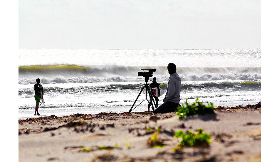 Passing By: OBX 2011. Surfer/Filmmaker Joe Cheshire taking in the moment. Photo: <a href=\"https://www.chrisfrickphotography.com/\" target=_blank>Chris Frick</a>.