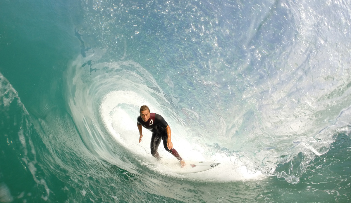 Chris Ward standing tall in a SoCal tube.