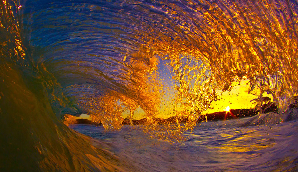 One of my favorite things in world is to sit in the water by myself at dark waiting for the sun to come up. It\'s so peaceful as it\'s just you and your thoughts. Because of the volcanic haze, when the sun finally does rise, we get to enjoy these magnificent colors for about fifteen to twenty minutes. Photo: <a href=\"https://www.christianlacuestaphotography.com\"> Christian LaCuesta</a>.