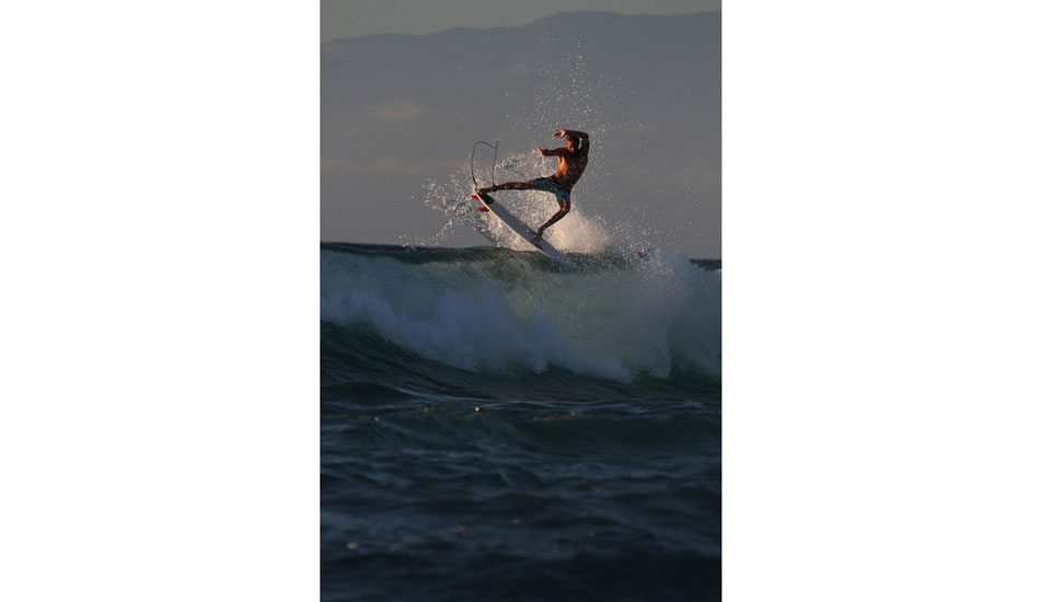 Surfer: Mac Feeny showing off his fins to the pack out the back Photo: <a href=\"https://www.christianlacuestaphotography.com\"> Christian LaCuesta</a>.
