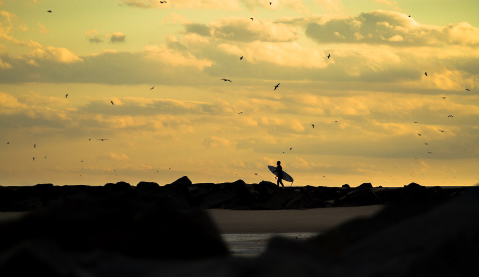 Unknown surfer making his way out for one last ride. Photo: <a href=\"https://christor.photoshelter.com/\" target=_blank>Christor Lukasiewicz</a>