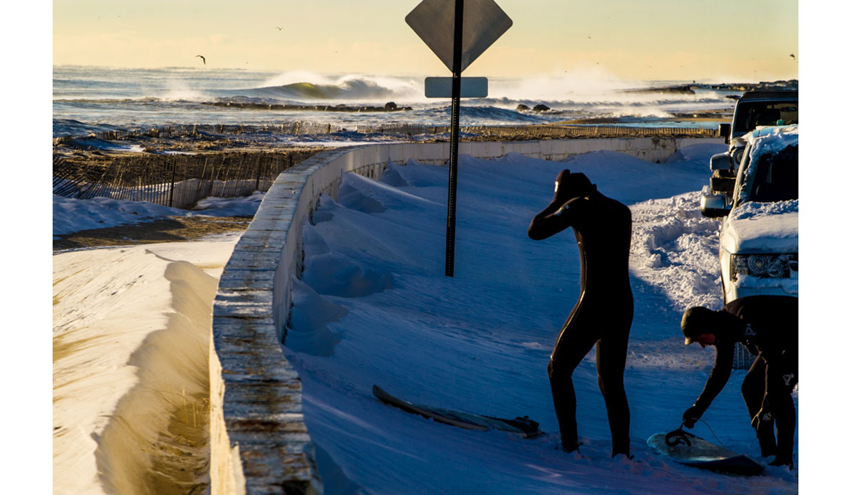 Unknown surfers gearing up for a sub zero surf session in New Jersey. Photo: <a href=\"https://www.christorphotography.com/\">Christor Lukasiewicz</a>